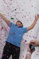 kid blowing confetti photo