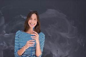 woman holding a internet cable in front of chalk drawing board photo