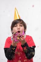 kid blowing confetti photo