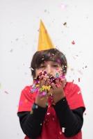 kid blowing confetti photo