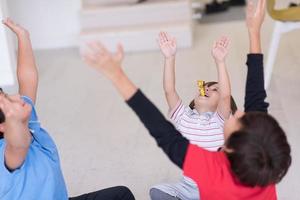 young boys having fun on the floor photo