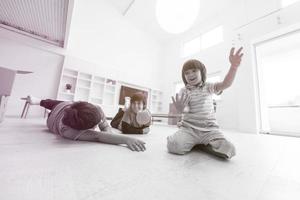 boys having fun with an apple on the floor photo