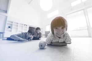 boys having fun with an apple on the floor photo