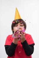 kid blowing confetti photo