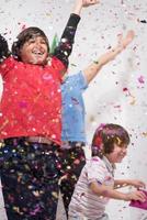 kids  blowing confetti photo