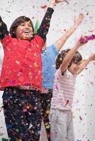 kids  blowing confetti photo