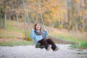 kids swing in the park photo