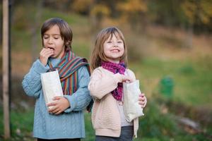 kids in park eating popcorn in park photo