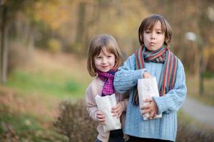 kids in park eating popcorn in park photo