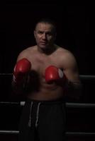 professional kickboxer in the training ring photo