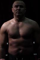 portrait of muscular professional kickboxer photo