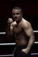 professional kickboxer in the training ring photo