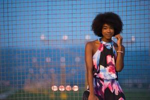 portrait of a young African-American woman in a summer dress photo