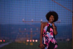 portrait of a young African-American woman in a summer dress photo