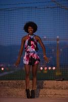 portrait of a young African-American woman in a summer dress photo