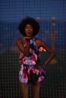 portrait of a young African-American woman in a summer dress photo