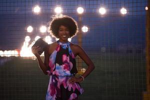 portrait of a young African-American woman in a summer dress photo