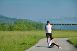 people doing stretching exercise  after jogging photo