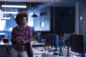 portrait of a young successful African-American woman in modern office photo