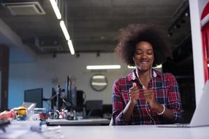 portrait of a young successful African-American woman in modern office photo