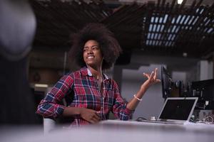 portrait of a young successful African-American woman in modern office photo