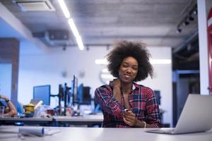 portrait of a young successful African-American woman in modern office photo