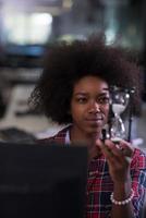 portrait of a young successful African-American woman in modern office photo