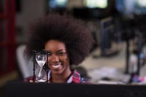 portrait of a young successful African-American woman in modern office photo
