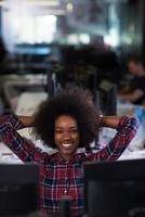 portrait of a young successful African-American woman in modern office photo