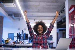 portrait of a young successful African-American woman in modern office photo