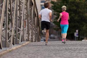 Couple jogging outside photo