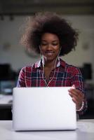 portrait of a young successful African-American woman in modern office photo