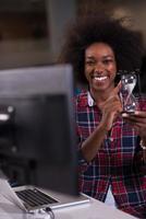 portrait of a young successful African-American woman in modern office photo