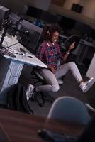 portrait of a young successful African-American woman in modern office photo