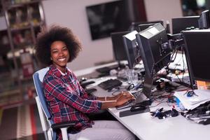 portrait of a young successful African-American woman in modern office photo
