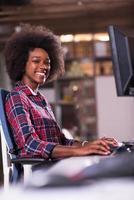 portrait of a young successful African-American woman in modern office photo