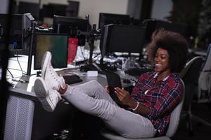 portrait of a young successful African-American woman in modern office photo