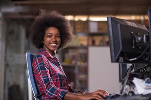 portrait of a young successful African-American woman in modern office photo