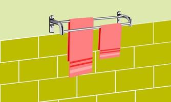 Towels hang on the clothesline on the bathroom tile wall small and large pink towels hang on a stainless steel rod.