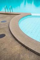 Swimming pool with stair at hotel close up photo