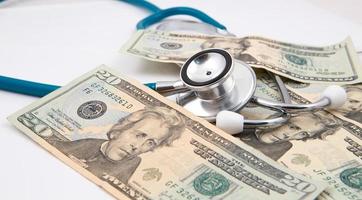 Stethoscope on money background photo