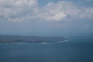 Bali island in tropical sea, veiw from airplane sight photo