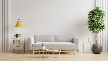 sala de estar escandinava con sofá gris sobre fondo de pared blanco vacío.