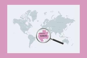 Map of Gabon on political world map with magnifying glass vector