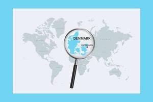 Map of Denmark on political world map with magnifying glass vector