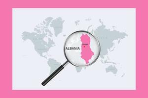 Map of Albania on political world map with magnifying glass vector