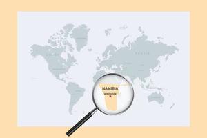 Map of Namibia on political world map with magnifying glass vector