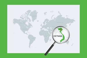 Map of Vietnam on political world map with magnifying glass vector