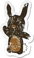 retro distressed sticker of a cartoon happy rabbit vector