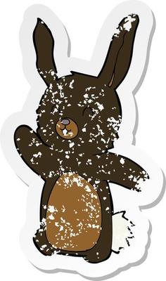 retro distressed sticker of a cartoon happy rabbit